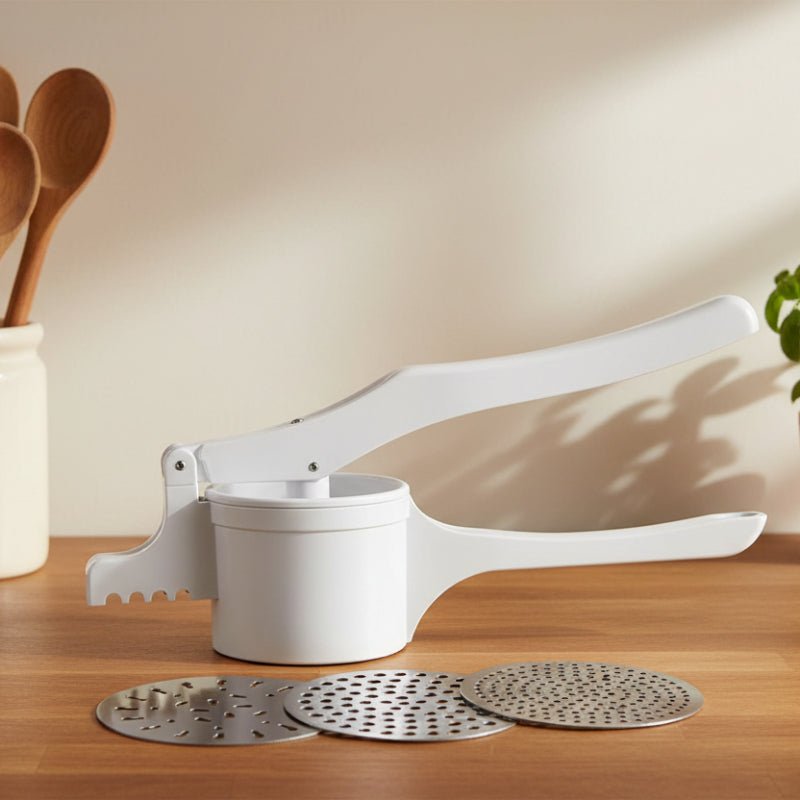 presse purée avec trois disques différentes textures purée