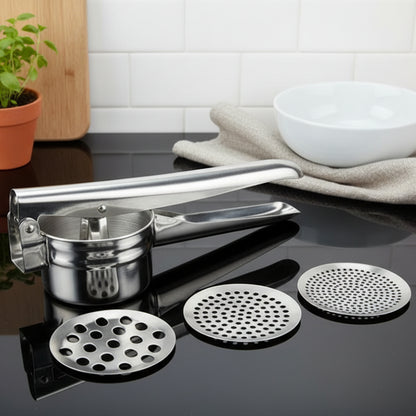 presse purée manuel sur comptoir avec différents disques